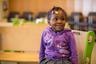 Child receiving care at CHAM at facilities